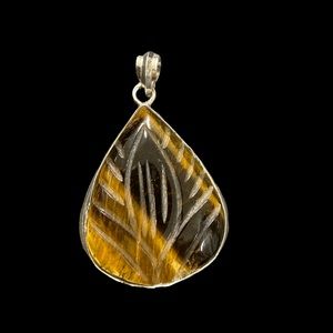 Carved tigers eye pendant